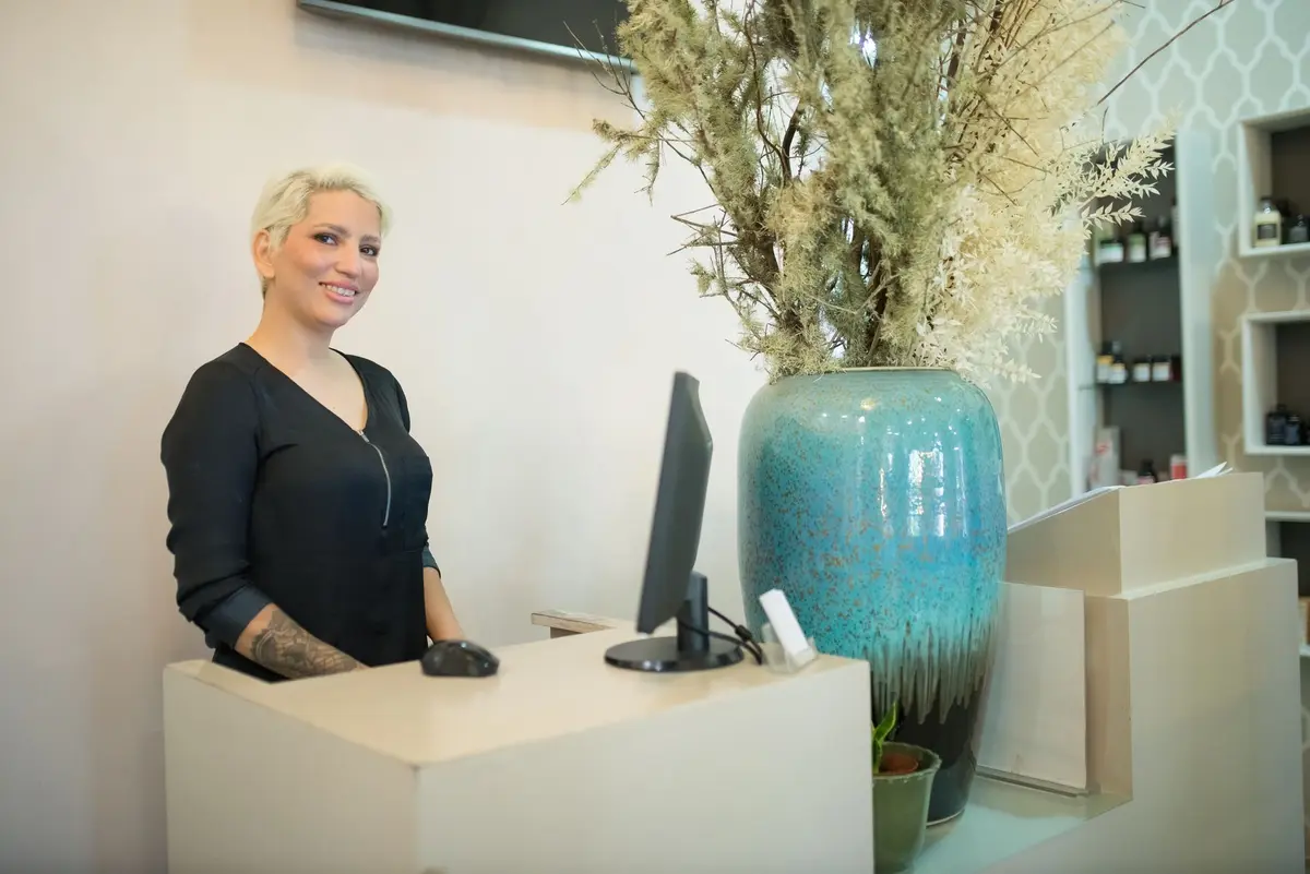 Stock photo: salon receptionist working at desk