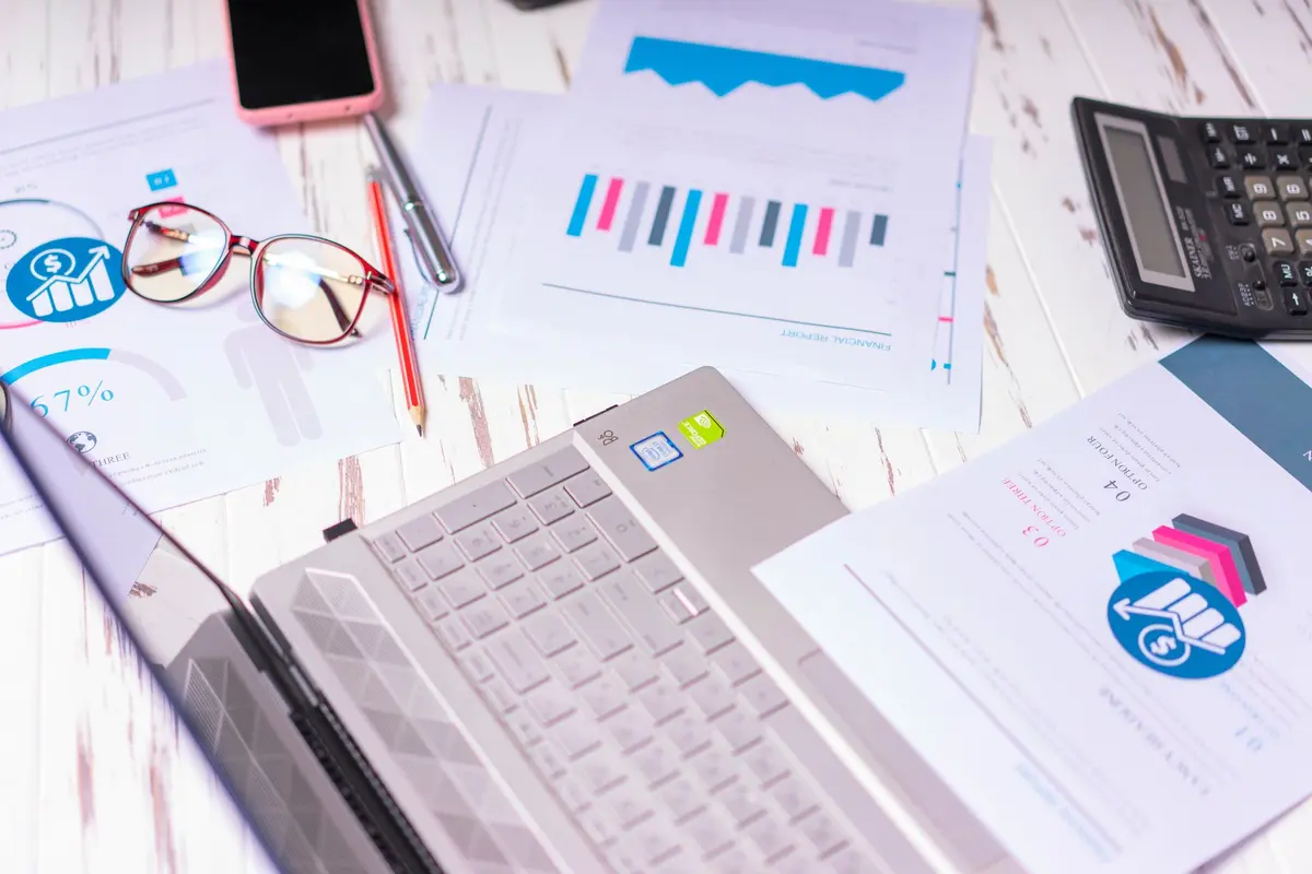 Stock photo: laptop, office desk, financial documents